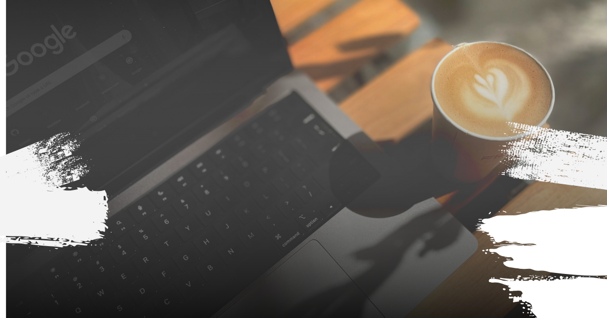 A computer and coffee sitting side-by-side on a table